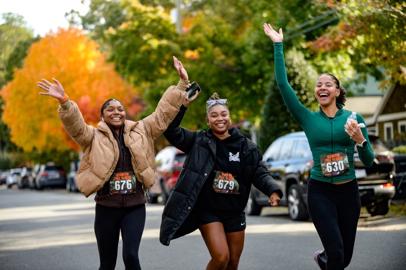 Ashley Jones, 25, Angelina Jones, 26, and Naomi McBride, 20, near the 
end of the Sea Witch 5K in Rehoboth Beach. The girls are from Maryland. DAVE FREDERICK PHOTOS